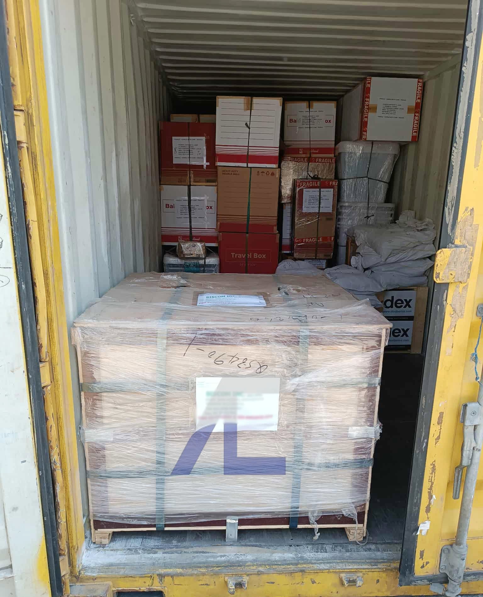 An Arditech-branded pallet and cargo packed inside a shipping container ready for movement